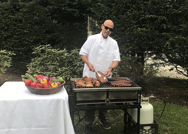 Fella Grilling Chicken & Ribs